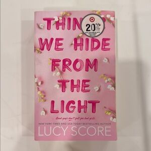 Pink Book 'Things We Hide from the Light' by Lucy Score